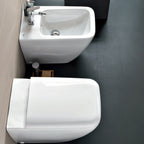 Sanitari filomuro con bidet e wc Rimless a scarico universale e sedile soft close modello Metrica Pozzi Ginori cm 56